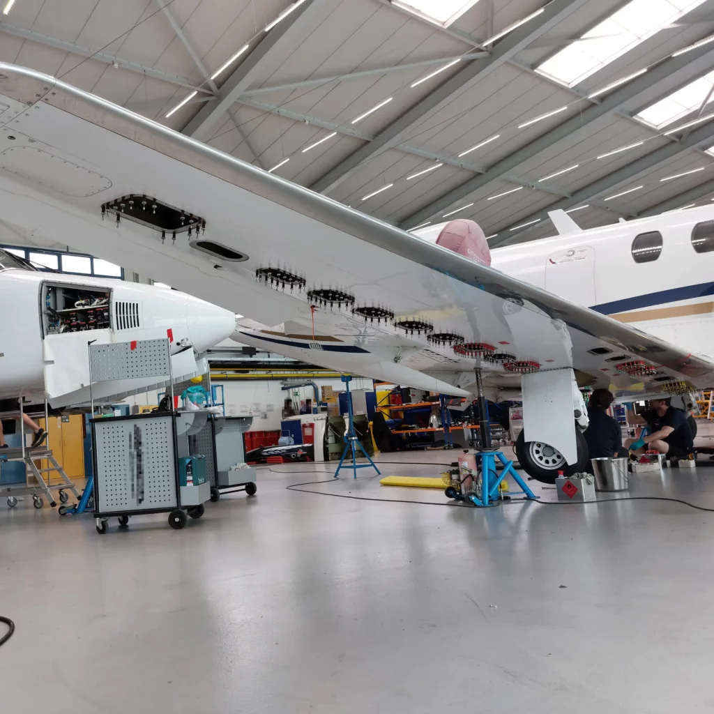 Fuel tank retainer installed with additional rivets on a Cessna Citation CJ2