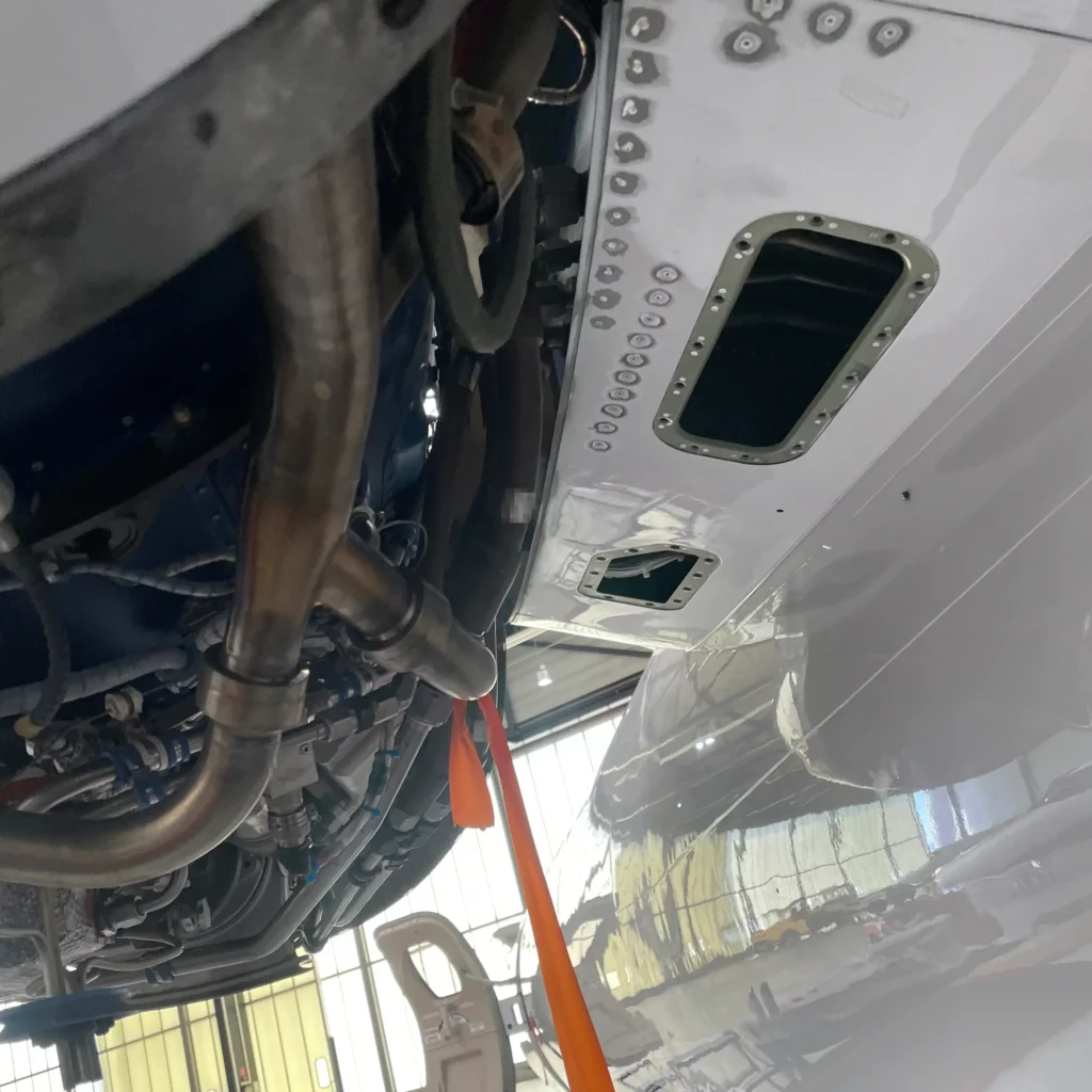 Replacement rivets set in the lower pylon skin of a Citation XLS+